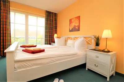 Ein Bett oder Betten in einem Zimmer der Unterkunft Birkenhof App 12
