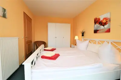 Ein Bett oder Betten in einem Zimmer der Unterkunft Birkenhof App 13