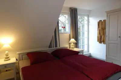 Ein Bett oder Betten in einem Zimmer der Unterkunft Am Lütten Bagen Darßer Pianohaus