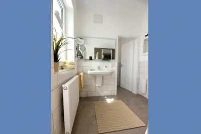 Ein Badezimmer in der Unterkunft Ferienhäuser Ferienhaus, Uns Boddenhuesing