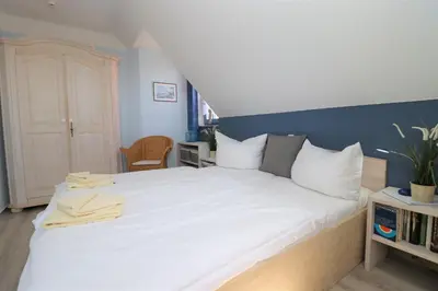 Ein Bett oder Betten in einem Zimmer der Unterkunft Ferienhäuser Uns Lütt Hus