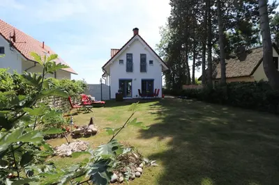Ein Garten an der Unterkunft Ferienhäuser Uns Lütt Hus