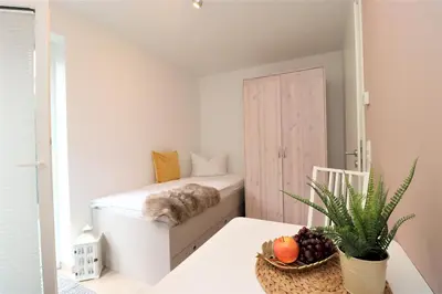 Ein Bett oder Betten in einem Zimmer der Unterkunft Aquamarin Ostseetraumsuite 02