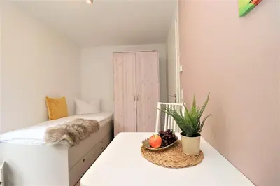 Ein Bett oder Betten in einem Zimmer der Unterkunft Aquamarin Ostseetraumsuite 02