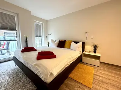 Ein Bett oder Betten in einem Zimmer der Unterkunft Aquamarin Ostseetraumsuite 09