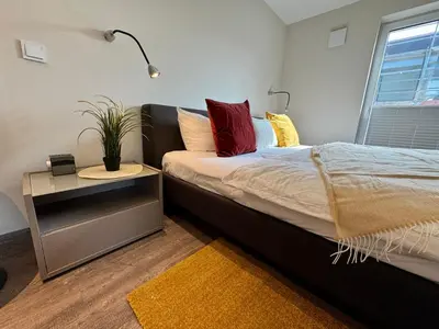 Ein Bett oder Betten in einem Zimmer der Unterkunft Aquamarin Ostseetraumsuite 10