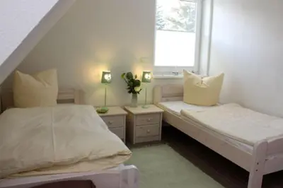 Ein Bett oder Betten in einem Zimmer der Unterkunft Strandhaus Strandhaus, App 01