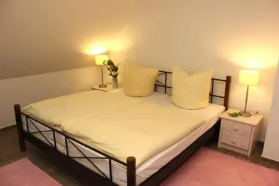 Ein Bett oder Betten in einem Zimmer der Unterkunft Strandhaus Strandhaus, App 01