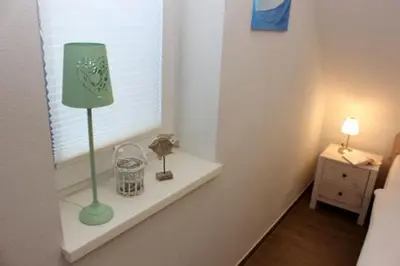 Ein Bett oder Betten in einem Zimmer der Unterkunft Strandhaus Strandhaus, App 02