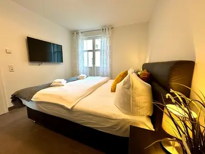 Ein Bett oder Betten in einem Zimmer der Unterkunft Bickbeeren Schweiz Villa Catrina, App 06