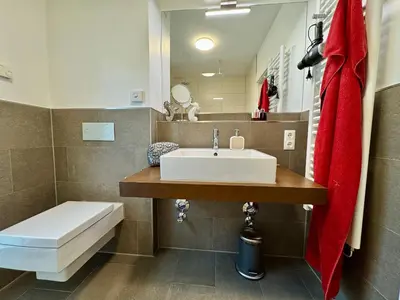 Ein Badezimmer in der Unterkunft Bickbeeren Schweiz Villa Catrina, App 06