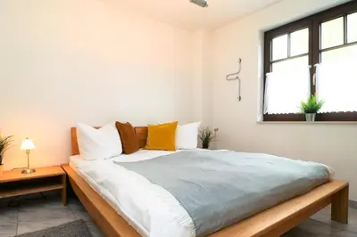 Ein Bett oder Betten in einem Zimmer der Unterkunft Ferienwohnungen Stückweg App 01
