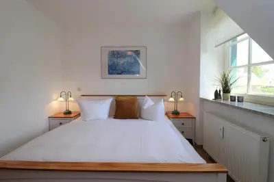 Ein Bett oder Betten in einem Zimmer der Unterkunft Alter Krug App 11