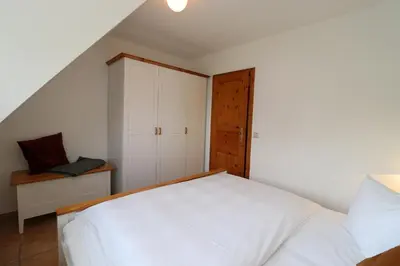 Ein Bett oder Betten in einem Zimmer der Unterkunft Alter Krug App 11