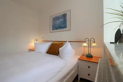 Ein Bett oder Betten in einem Zimmer der Unterkunft Alter Krug App 11