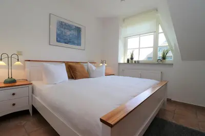 Ein Bett oder Betten in einem Zimmer der Unterkunft Alter Krug App 11