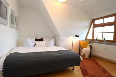 Ein Bett oder Betten in einem Zimmer der Unterkunft Alter Krug App 15
