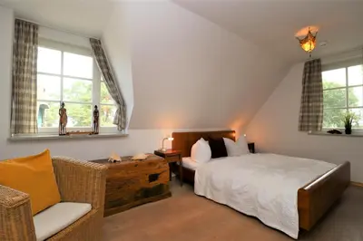 Ein Bett oder Betten in einem Zimmer der Unterkunft Alter Krug App 22, Coco de Mer