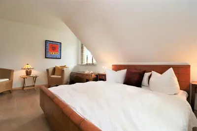 Ein Bett oder Betten in einem Zimmer der Unterkunft Alter Krug App 22, Coco de Mer