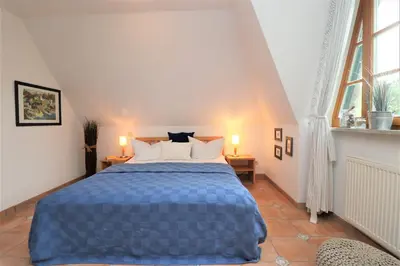 Ein Bett oder Betten in einem Zimmer der Unterkunft Alter Krug App 25