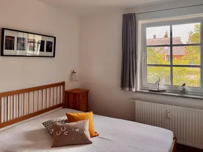 Ein Bett oder Betten in einem Zimmer der Unterkunft Schmugglerhus App 2 8 Zeese