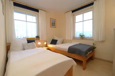 Ein Bett oder Betten in einem Zimmer der Unterkunft Boddenparadies App 03 