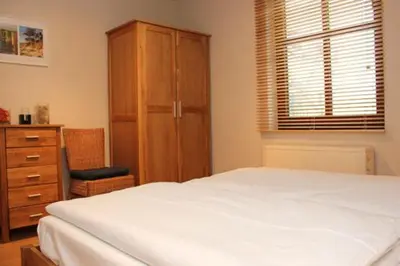 Ein Bett oder Betten in einem Zimmer der Unterkunft Ferienhäuser Ferienhaus Xenia
