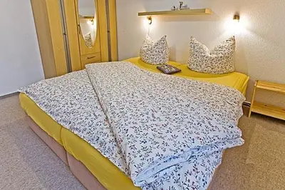 Ein Bett oder Betten in einem Zimmer der Unterkunft Mühlenweg, App 01