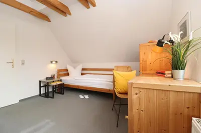 Ein Bett oder Betten in einem Zimmer der Unterkunft Ferienhäuser Alte Feuerwehr, 