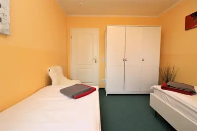 Ein Bett oder Betten in einem Zimmer der Unterkunft Achtern Hafen App 02