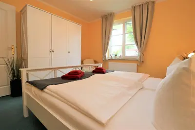 Ein Bett oder Betten in einem Zimmer der Unterkunft Achtern Hafen App 02