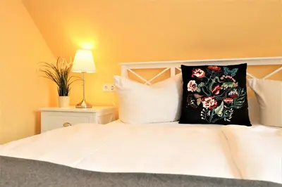 Ein Bett oder Betten in einem Zimmer der Unterkunft Achtern Hafen App 03