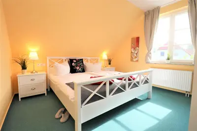 Ein Bett oder Betten in einem Zimmer der Unterkunft Achtern Hafen App 03