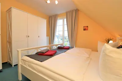 Ein Bett oder Betten in einem Zimmer der Unterkunft Achtern Hafen App 04