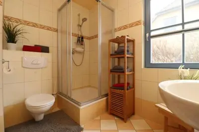 Ein Badezimmer in der Unterkunft Am Leuchfeuer App 01