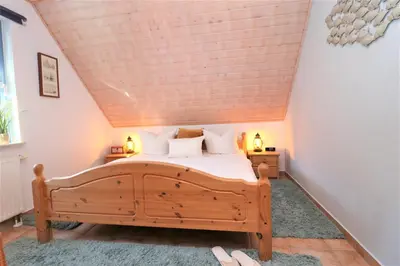 Ein Bett oder Betten in einem Zimmer der Unterkunft Am Leuchfeuer App 02