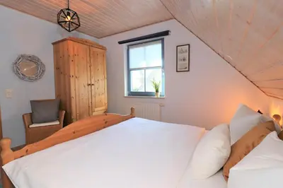 Ein Bett oder Betten in einem Zimmer der Unterkunft Am Leuchfeuer App 02
