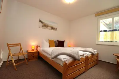 Ein Bett oder Betten in einem Zimmer der Unterkunft Am Leuchfeuer Haus Seeblick, App 03