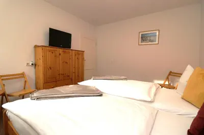 Ein Bett oder Betten in einem Zimmer der Unterkunft Am Leuchfeuer Haus Seeblick, App 03