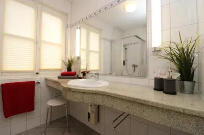 Ein Badezimmer in der Unterkunft Am Leuchfeuer Haus Seeblick, App 03