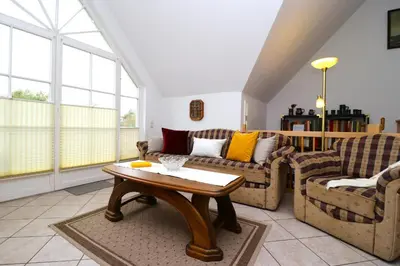 Ein Sitzbereich in der Unterkunft Am Leuchfeuer Haus Seeblick, App 04