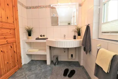 Ein Badezimmer in der Unterkunft Am Leuchfeuer App 06