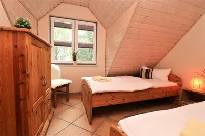 Ein Bett oder Betten in einem Zimmer der Unterkunft Am Leuchfeuer App 06