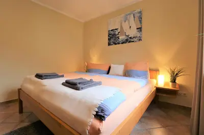 Ein Bett oder Betten in einem Zimmer der Unterkunft Am Leuchfeuer App 07