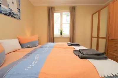 Ein Bett oder Betten in einem Zimmer der Unterkunft Am Leuchfeuer App 07