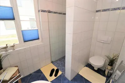 Ein Badezimmer in der Unterkunft Am Leuchfeuer App 07