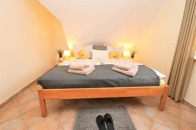 Ein Bett oder Betten in einem Zimmer der Unterkunft Am Leuchfeuer App 08