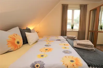 Ein Bett oder Betten in einem Zimmer der Unterkunft Am Leuchfeuer App 08