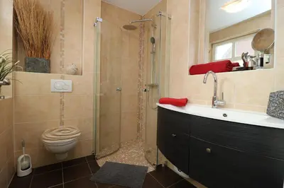Ein Badezimmer in der Unterkunft Am Park, App Dünennest