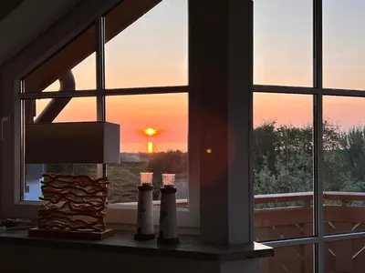 Blick auf den Sonnenuntergang/Sonnenaufgang von der Ferienwohnung aus oder aus der Nähe